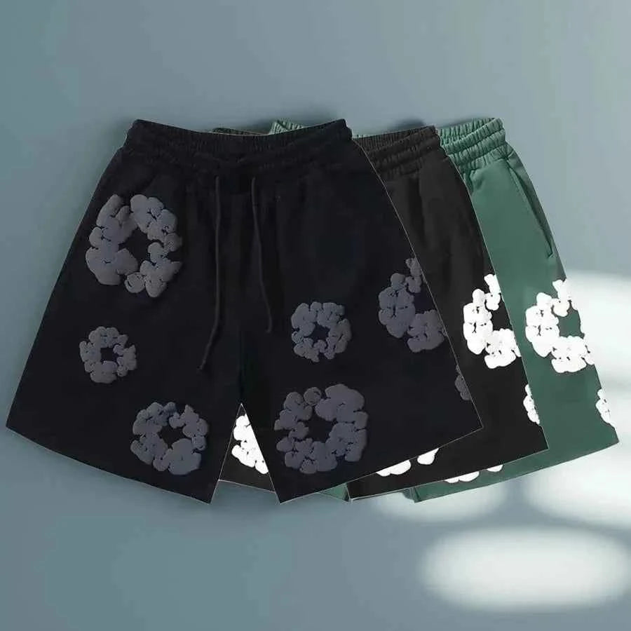 Men's bold floral print shorts, a streetwear essential with a comfy drawstring waist for summer and festivals.