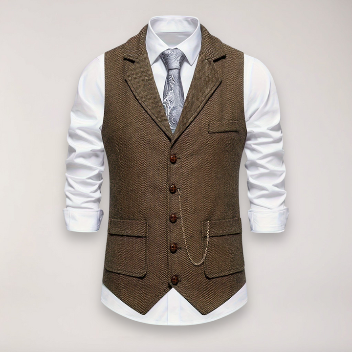 Close-up: Men's gray herringbone vest, showcasing texture & reversed collar detail. Smart casual layering piece.