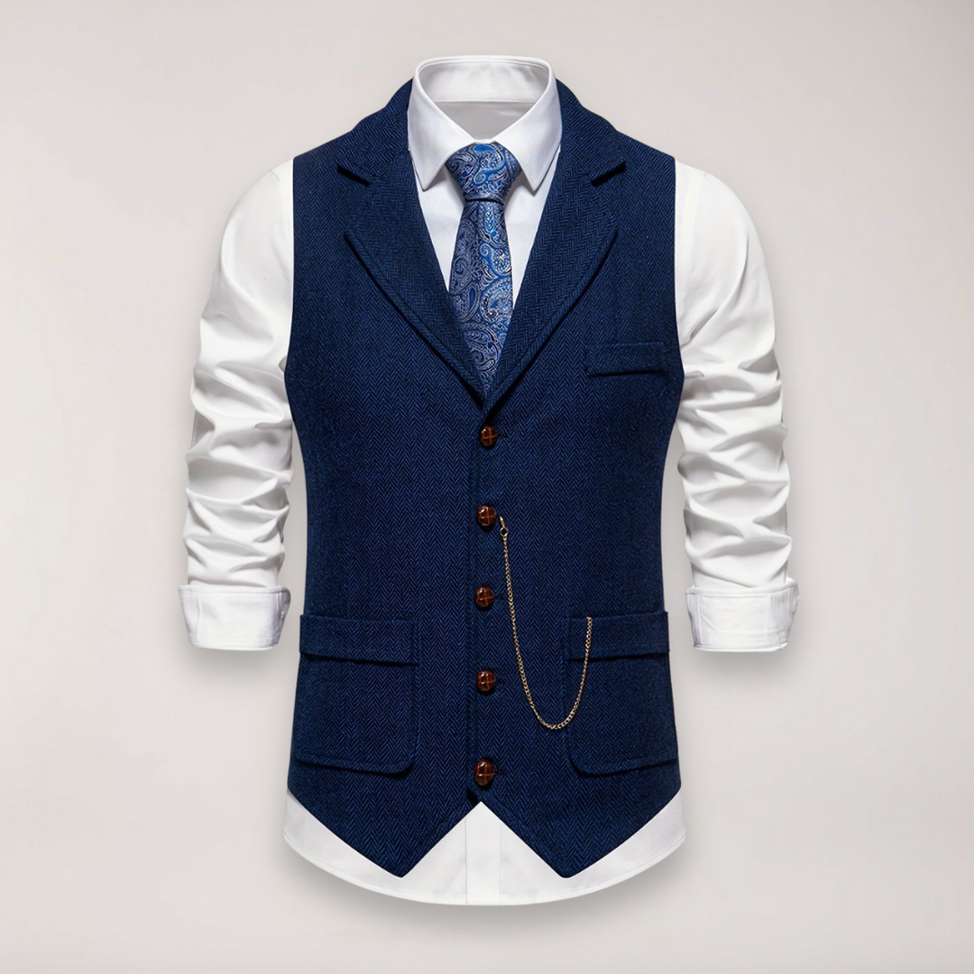 Stylish men's dress vest, herringbone pattern, reversed collar, paired for a smart formal or wedding outfit.