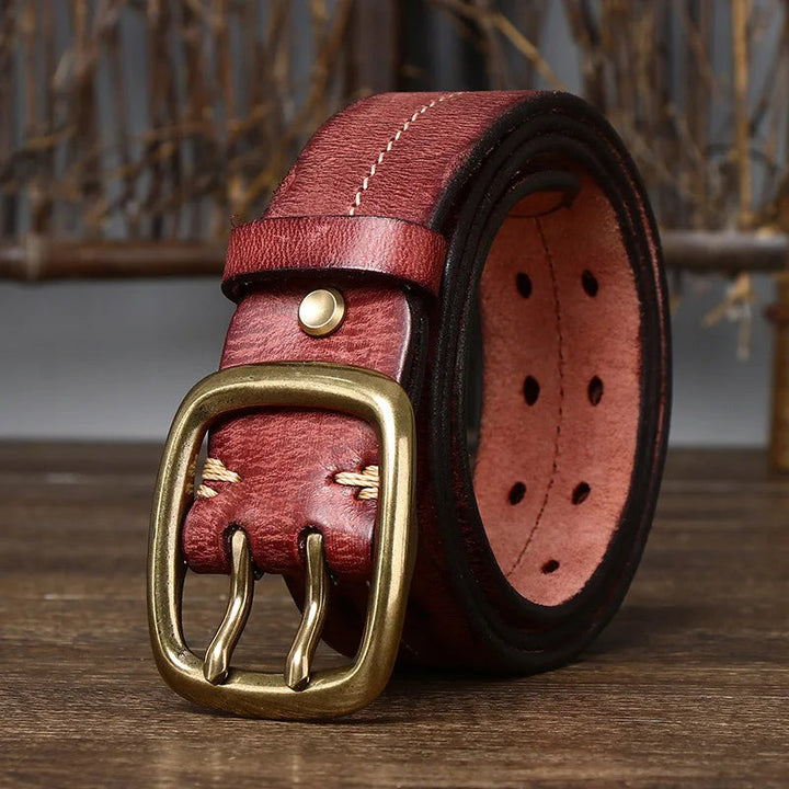 Red full-grain leather men's belt, a bold and stylish accessory with a solid brass buckle for a unique look.