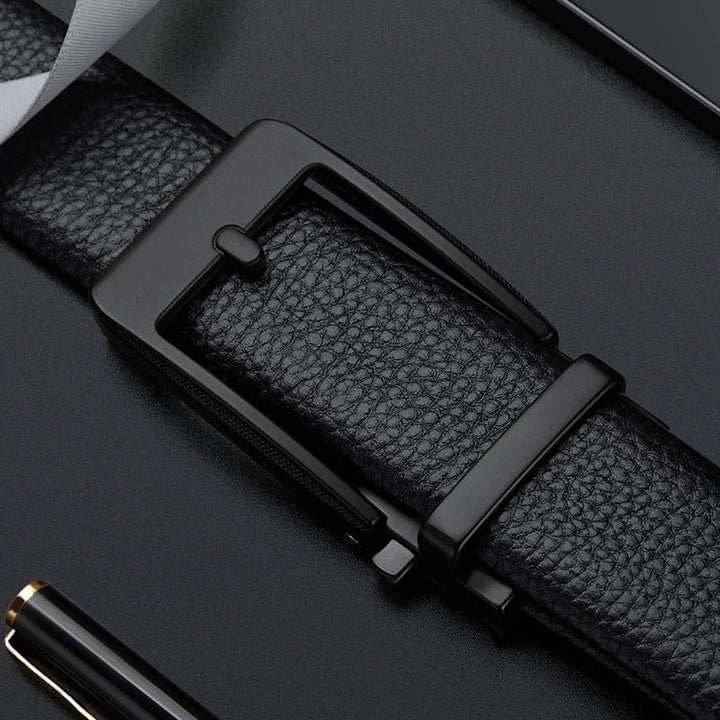 Sleek polished metal buckle on a durable men's genuine leather cowhide belt. Versatile for formal, business, or casual outfits.