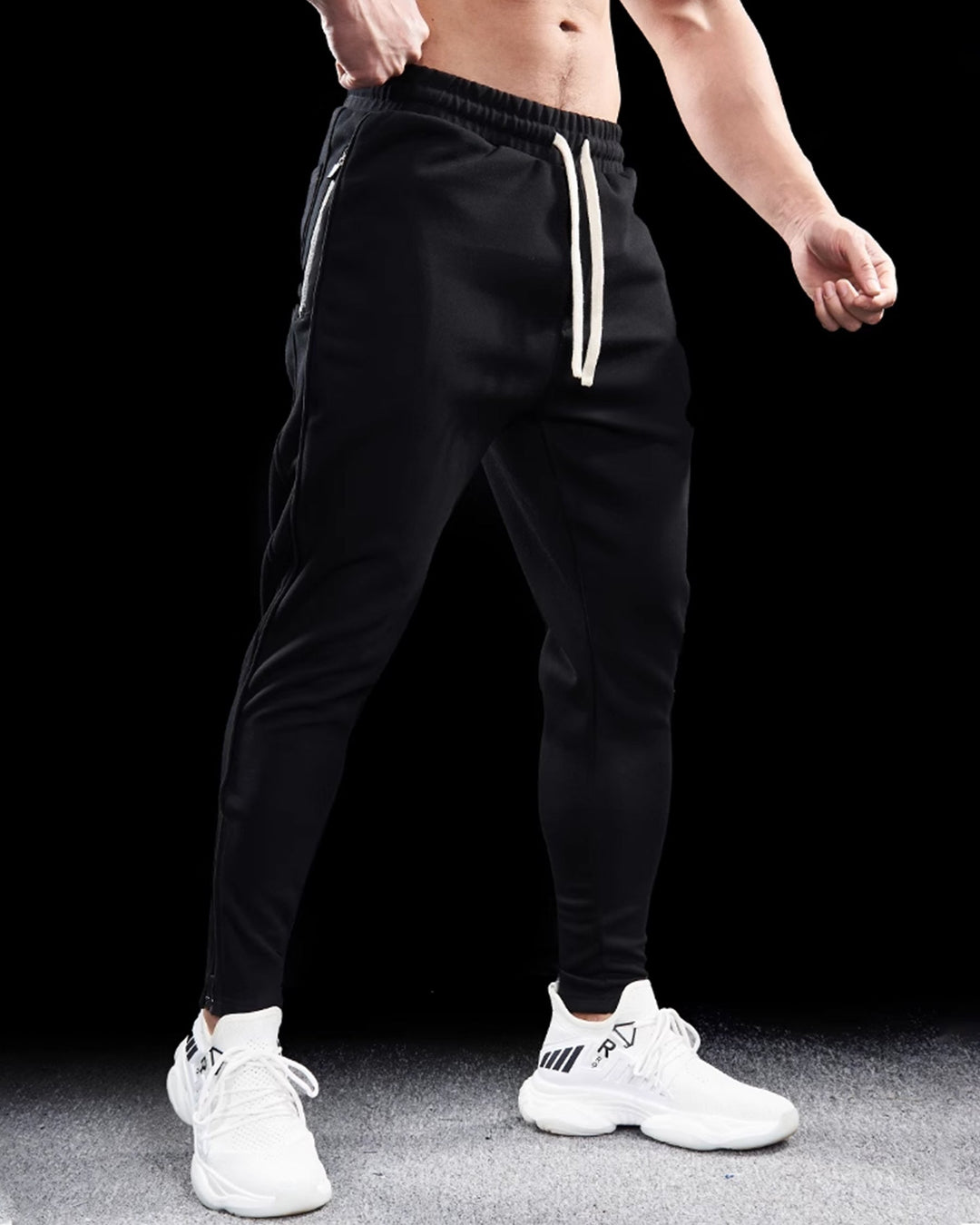 Men's Girona tapered joggers with functional zip hems, combining modern style and comfort.