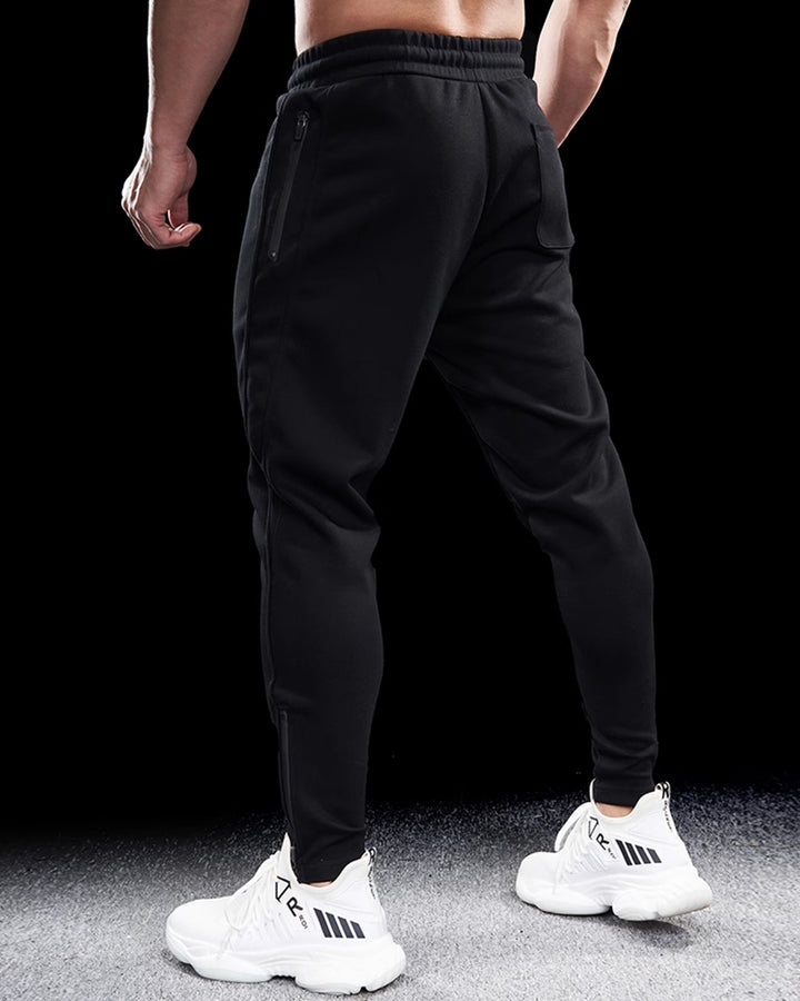 Modern men's Girona tapered zip joggers. Stylish athletic pants for streetwear & casual comfort.