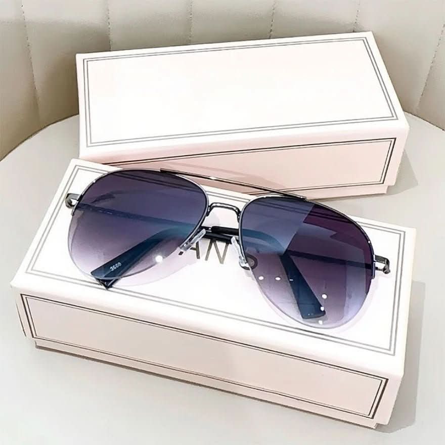 Man wearing stylish gradient pilot sunglasses, UV400 for outdoor sun protection.
