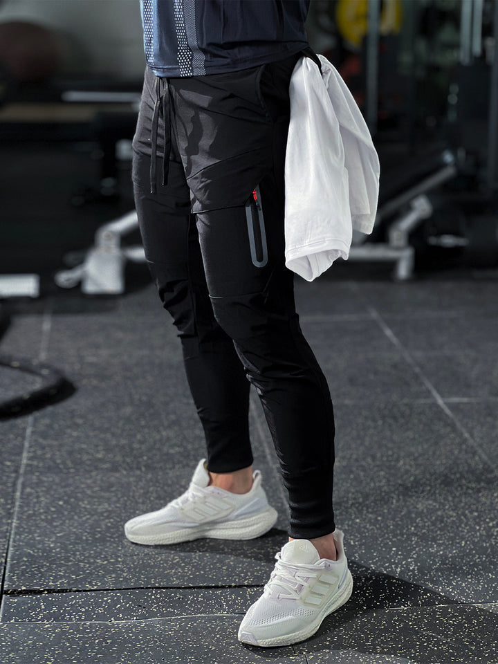 Men's casual cargo joggers with elastic waistband and cuffs, great for streetwear fashion trends.