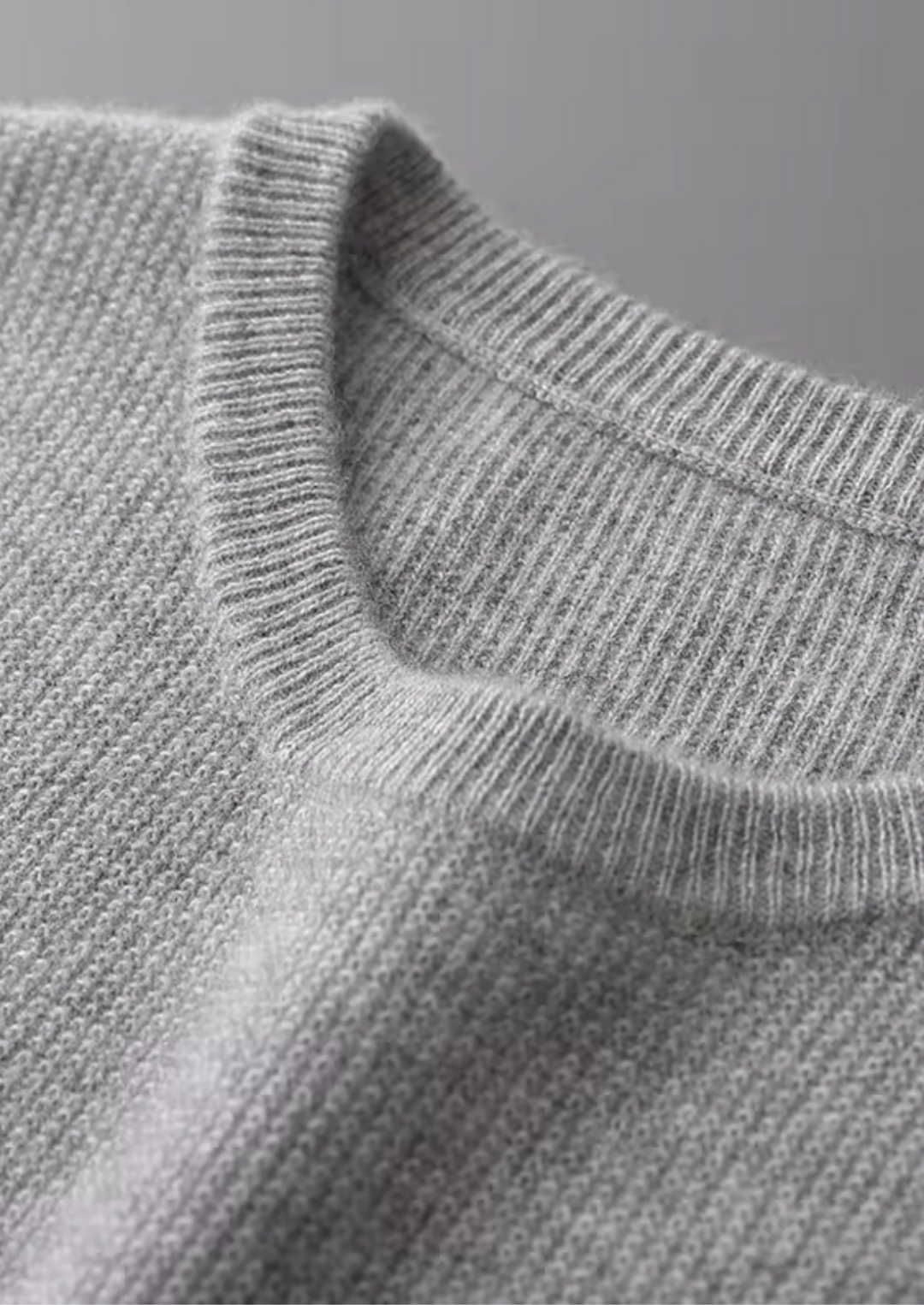 Light blue men's crew neck vest. Versatile sleeveless top, ideal for comfortable layering in casual outfits.