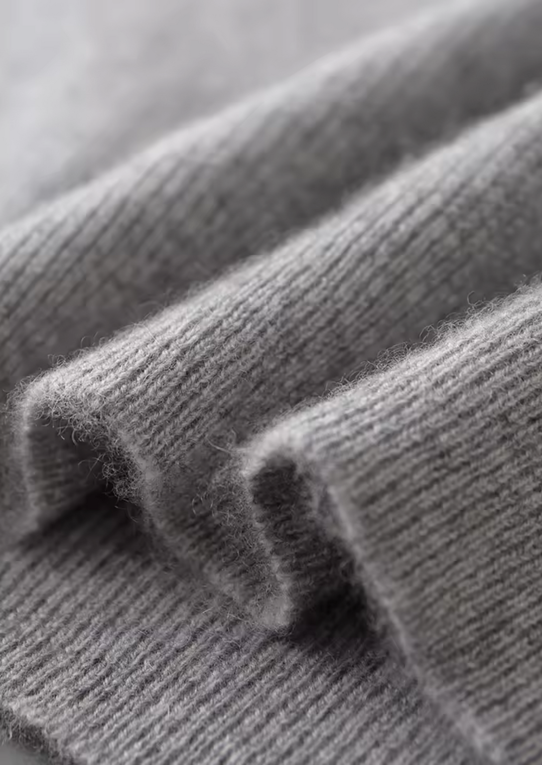 Sleek men's crew neck vest in gray, designed for comfortable, versatile layering. Essential sleeveless casual wear.