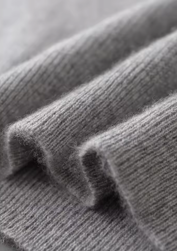 Sleek men's crew neck vest in gray, designed for comfortable, versatile layering. Essential sleeveless casual wear.