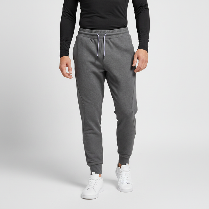 Men's grey elastic-waist jogger pants with drawstring, ultimate comfort & mobility for activewear.