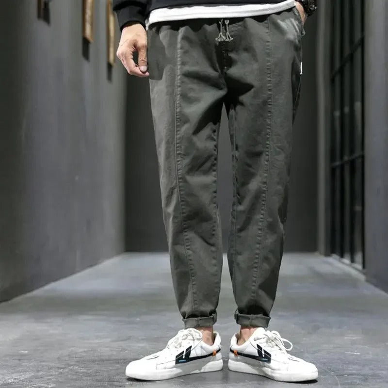Dark grey men's tapered joggers, soft cotton blend for superior comfort & fit.