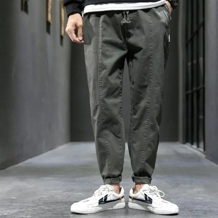Dark grey men's tapered joggers, soft cotton blend for superior comfort & fit.