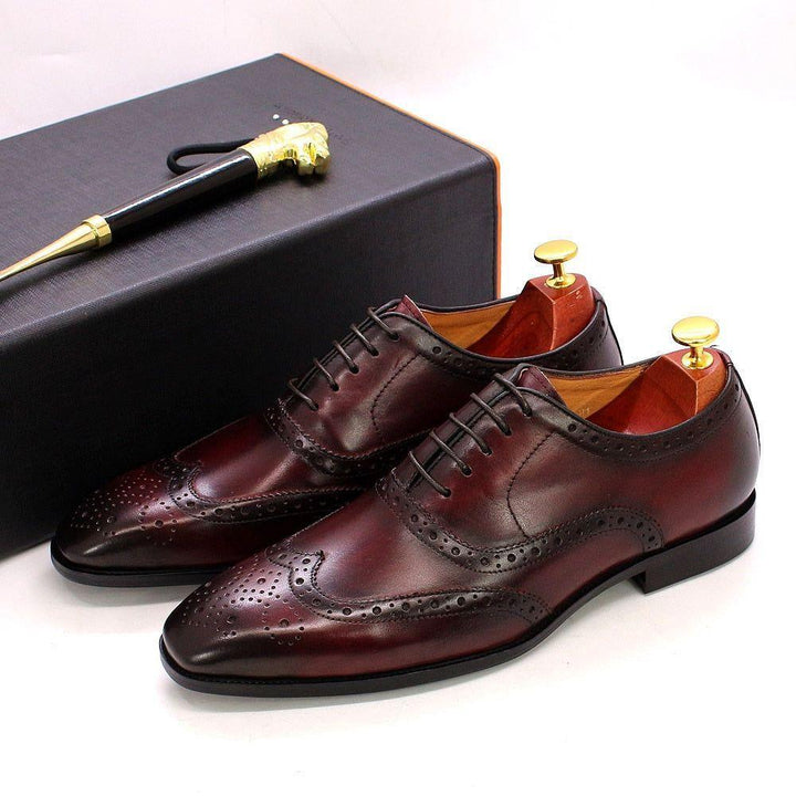 Men's handcrafted brown leather wingtip Oxford dress shoes, perfect for formal business attire & classic style.