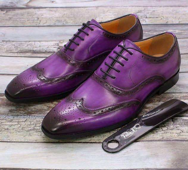 Handcrafted men's brown leather wingtip Oxford dress shoes, a timeless classic for formal occasions and business.