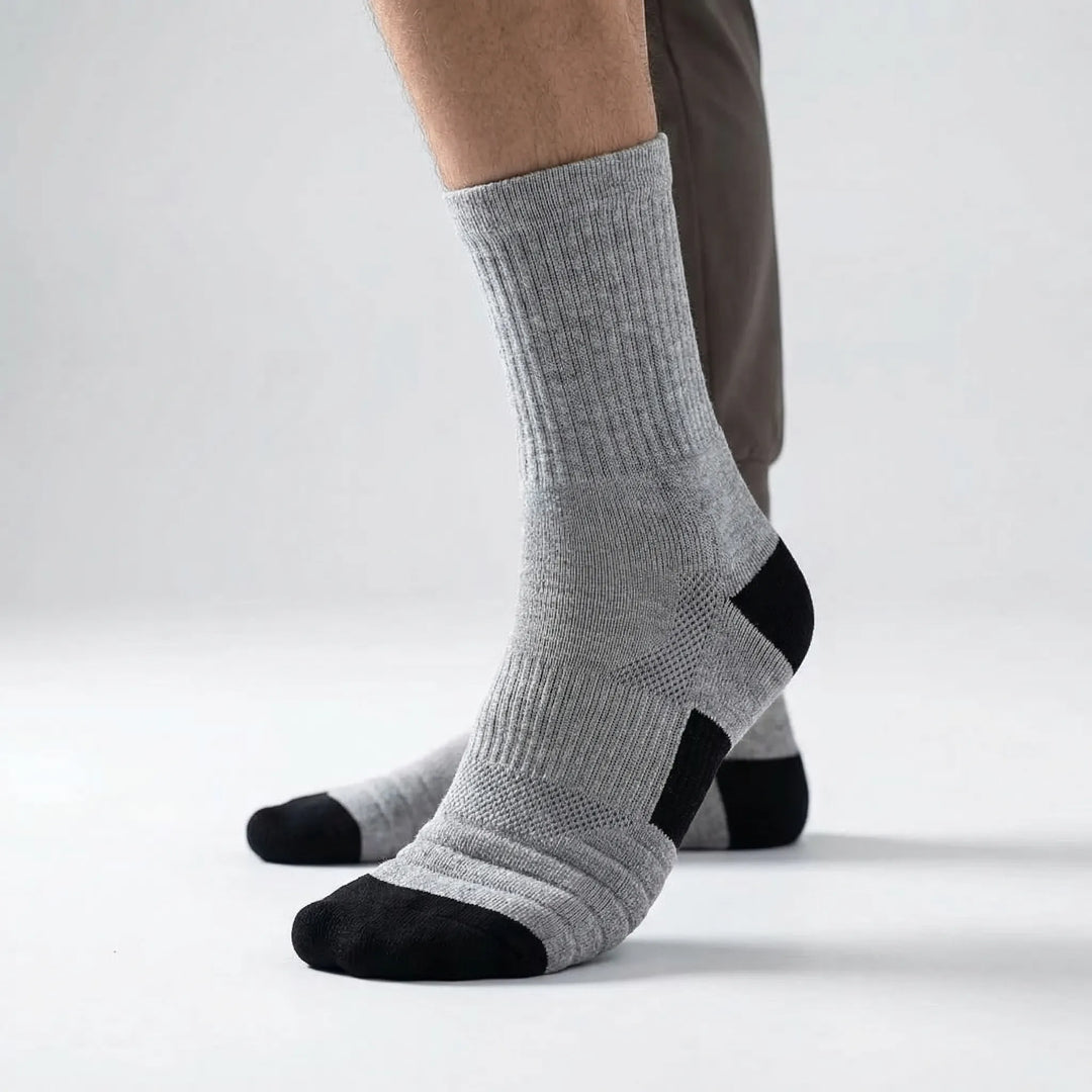 Close-up of men's high-tube compression athletic socks, moisture-wicking for basketball.