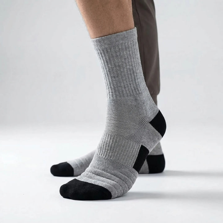 Close-up of men's high-tube compression athletic socks, moisture-wicking for basketball.