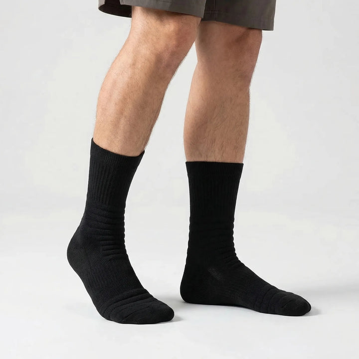 Moisture-wicking men's high-tube compression cycling socks, ideal for endurance sports.
