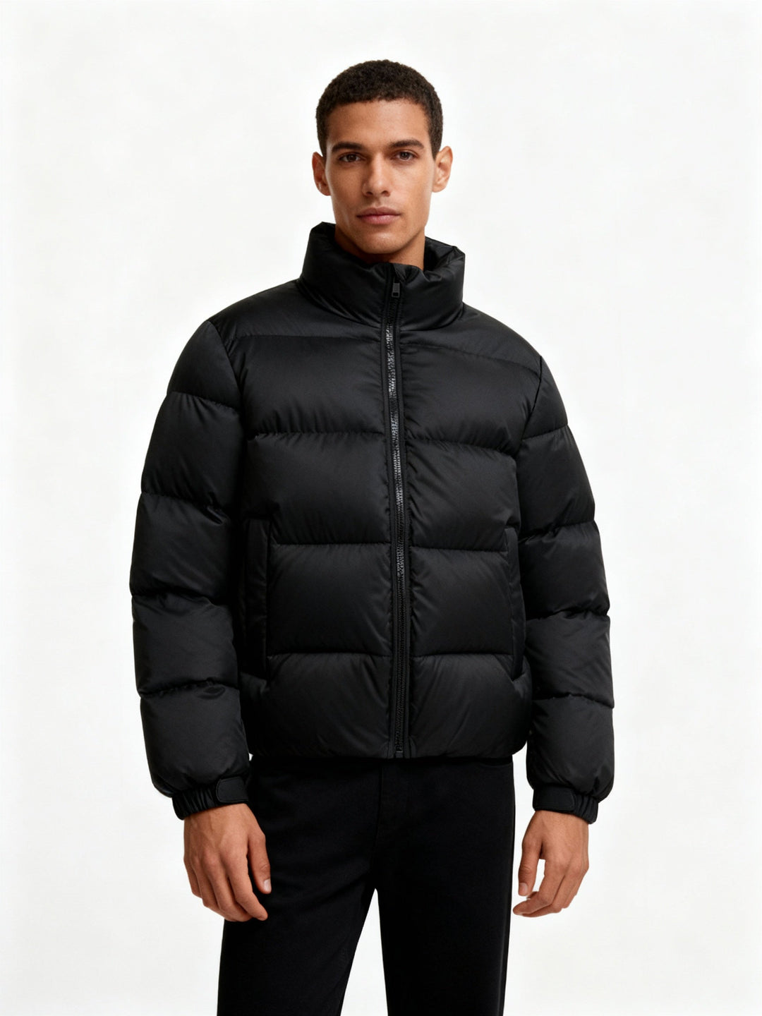 Insulated men's puffer jacket with hood, providing wind protection & warmth. Perfect casual winter wear.