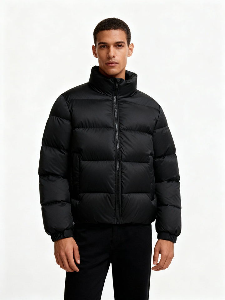 Insulated men's puffer jacket with hood, providing wind protection & warmth. Perfect casual winter wear.