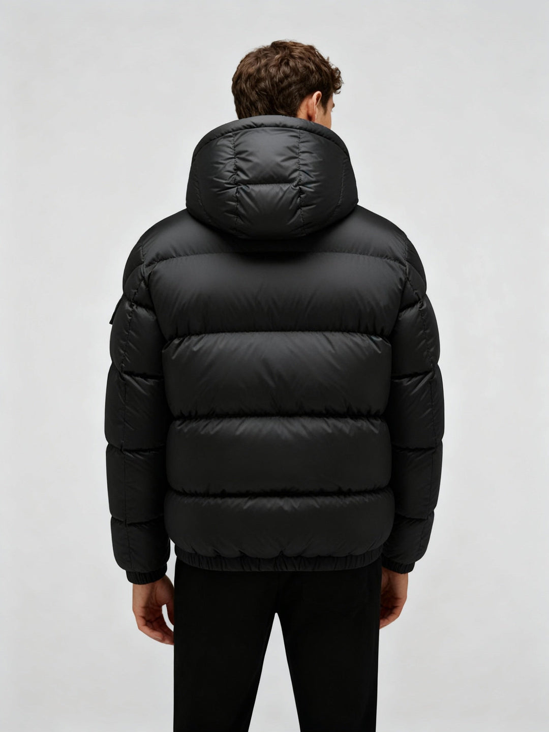 Sleek shiny men's puffer jacket, an essential warm winter coat for extreme cold weather comfort and style.