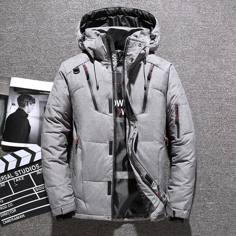 Close-up of the waterproof zipper & adjustable hood on a men's insulated parka for ultimate weather defense.