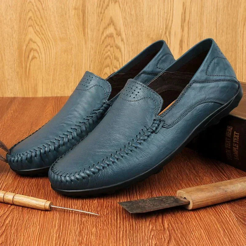 Elegant men's Italian loafers, classic slip-on design. Comfortable versatile footwear for sophisticated casual or dress.