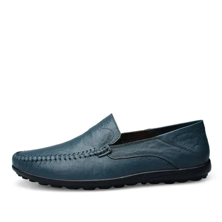 Close-up men's classic Italian style loafers, showing stitching and comfortable construction. Versatile slip-on shoes.