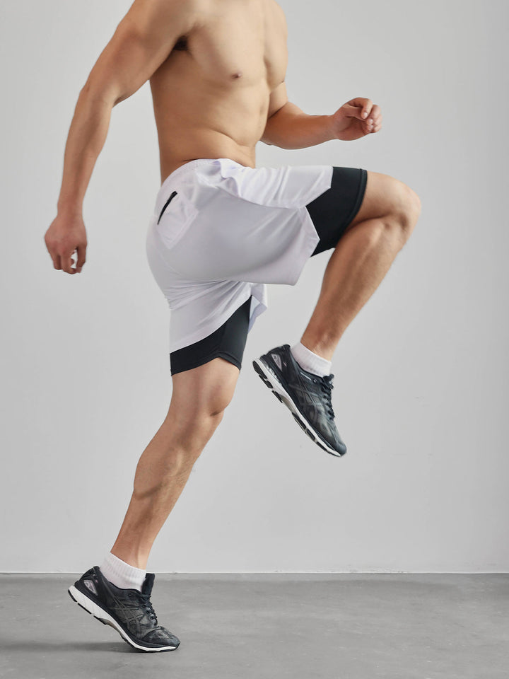 Man relaxing in Men's Kinetic Performance Active Shorts after a workout. Casual activewear for men.