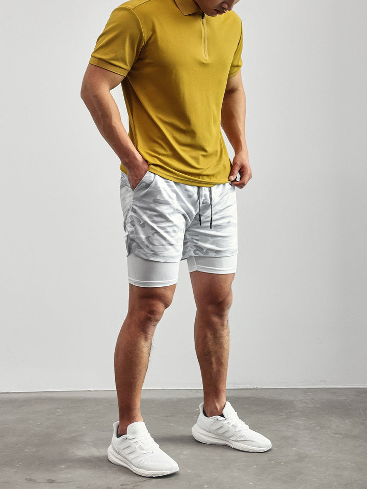 Man wearing Men's Kinetic Performance Active Shorts while exercising. Gym, workout, training focus.