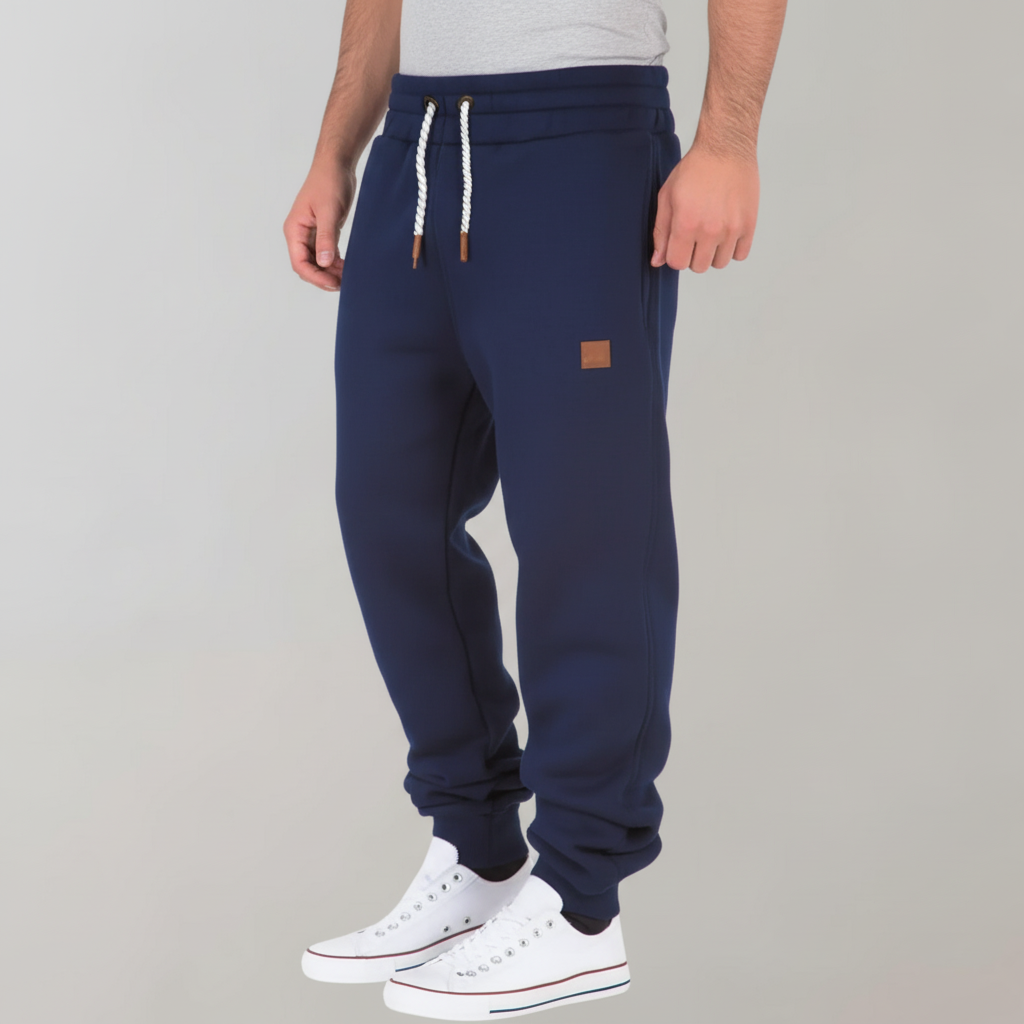 Comfortable men's slim-fit joggers with elastic waist & side pockets. Perfect for leisure & activewear.