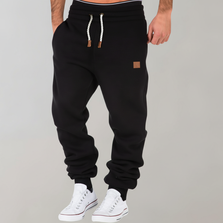 Fashionable men's slim-fit joggers. Modern casual pants for versatile everyday wear & active lifestyles.