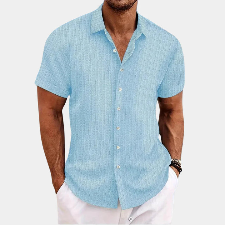 Short sleeve men's regular fit button-up shirt, ideal for warm weather and everyday style.