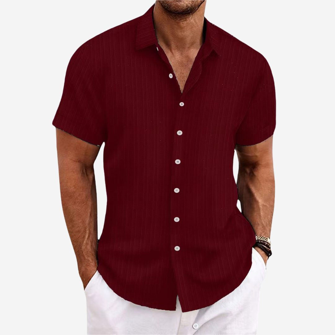 Men's short sleeve button-up shirt in a classic color, ideal for a smart casual summer look.