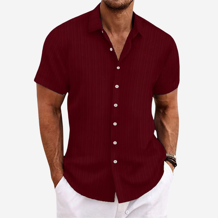 Men's short sleeve button-up shirt in a classic color, ideal for a smart casual summer look.