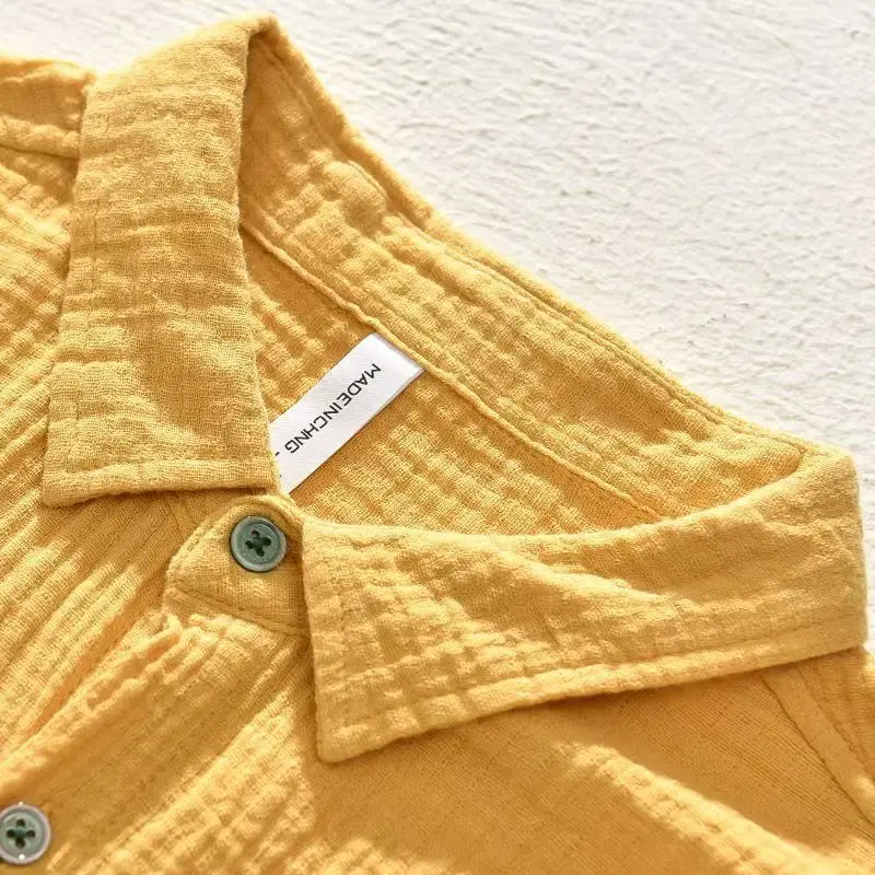 Close-up of a men's lightweight breathable casual button-up shirt featuring a single chest pocket.