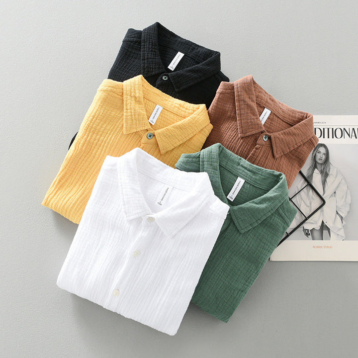 Relaxed fit men's lightweight button-up shirt with chest pocket, a breathable top for casual wear.