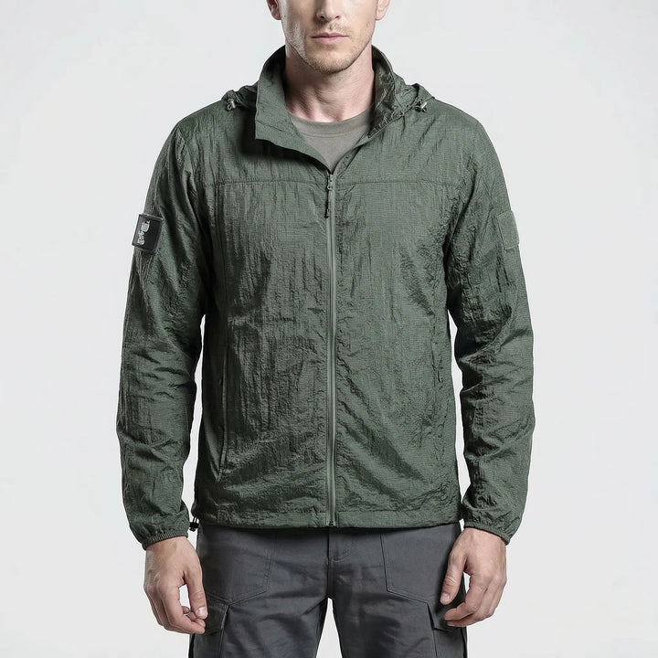 Packable men's hooded tactical windbreaker, water-resistant for hiking, camping & spring outdoor adventures.