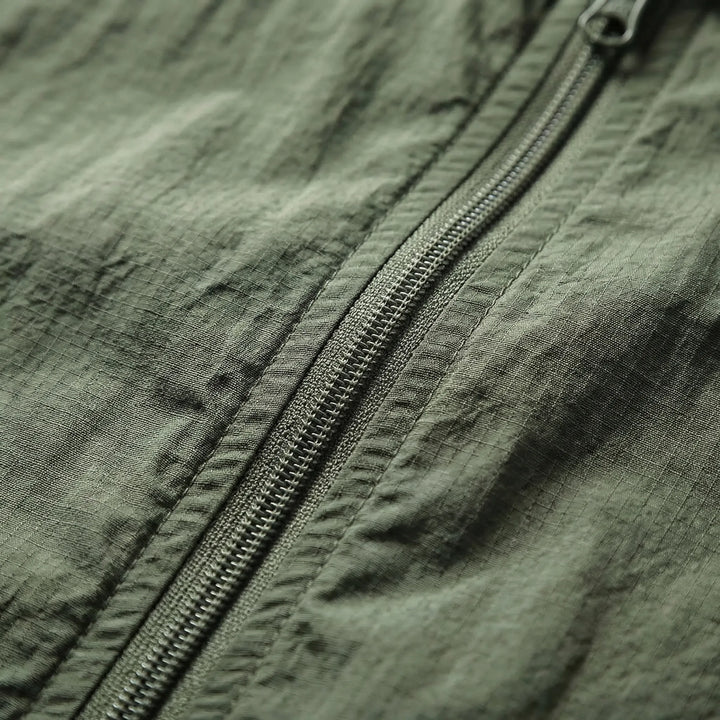 Lightweight men's windbreaker jacket with hood, perfect tactical gear for summer & spring activewear.