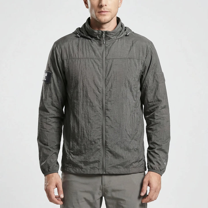Stylish men's lightweight hooded windbreaker, versatile tactical jacket for everyday wear & active travel.