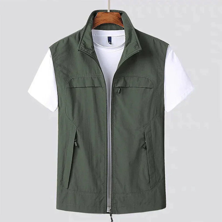 Versatile men's lightweight outdoor vest. Multi-pocket design for travel or casual layering. Colors: black, navy, army green.