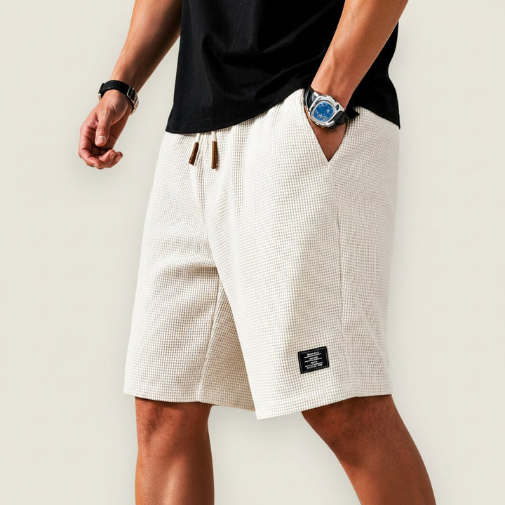 Comfortable men's relaxed fit drawstring shorts for summer, ideal for daily essential casual apparel.