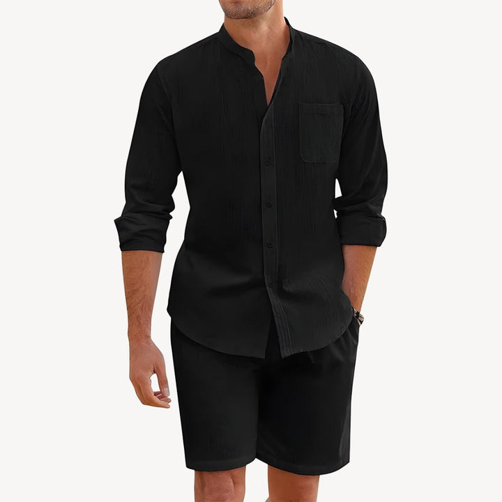 Relaxed fit men's two-piece summer outfit featuring a casual button-up shirt & comfortable drawstring shorts.