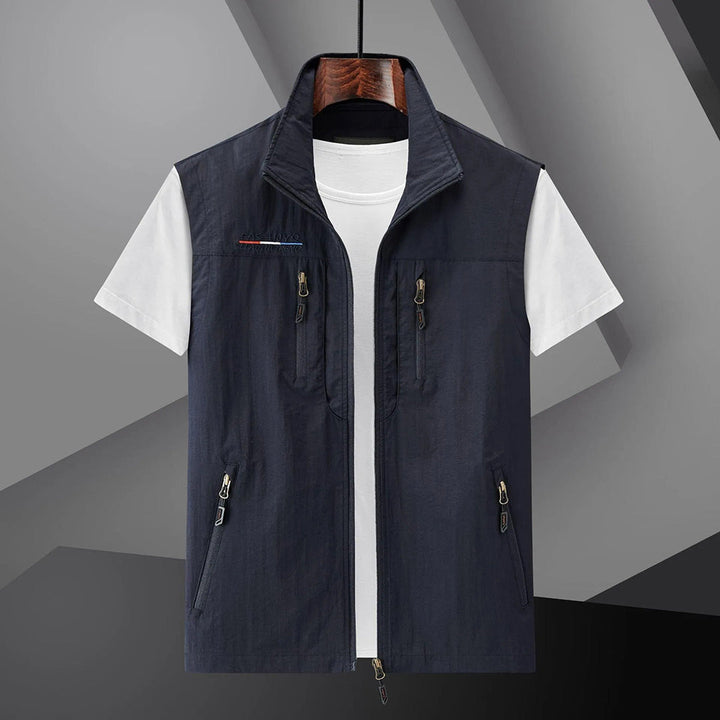 Men's lightweight utility vest for outdoor adventure, hiking, and travel, featuring multiple pockets.