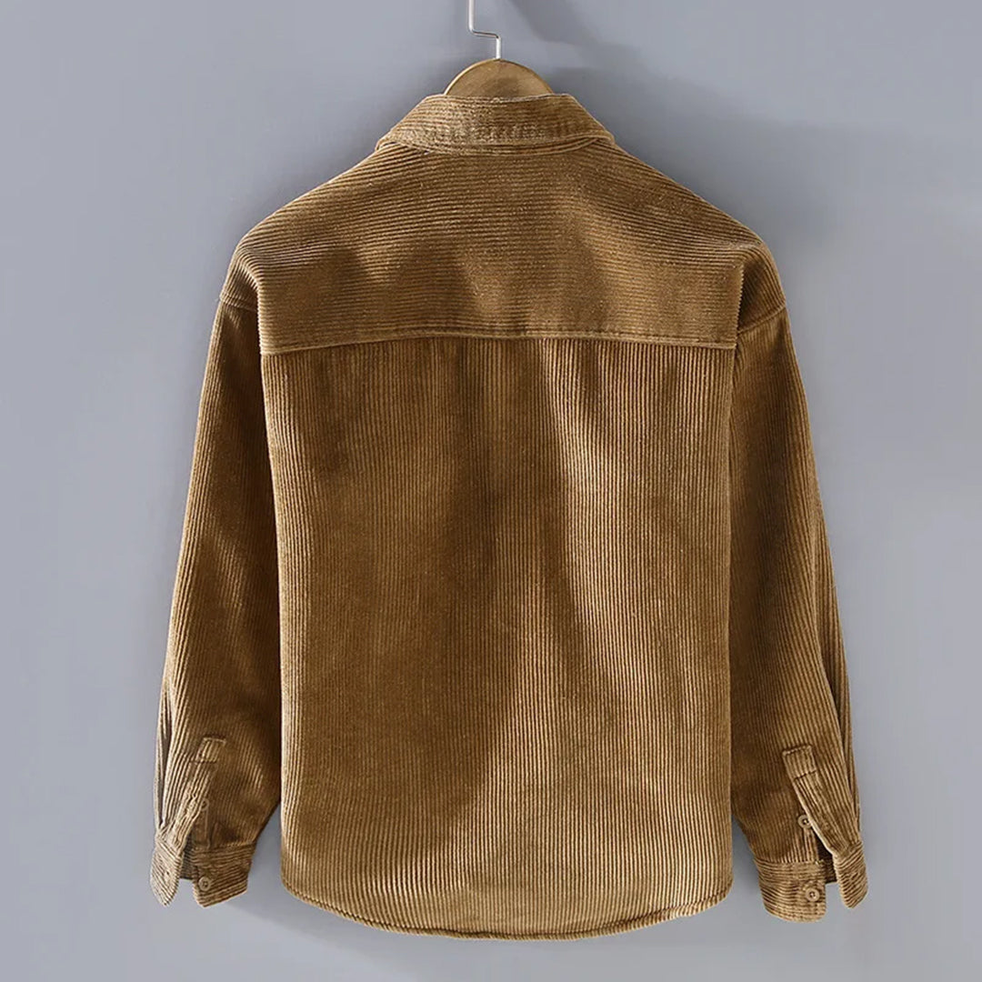 Stylish men's textured corduroy jacket, lined for warmth. Durable outerwear for fall & winter outfits.