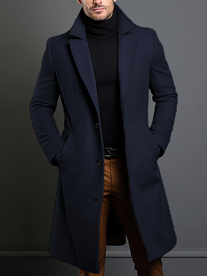 Stylish knee-length black overcoat for men, single-breasted lapel design, essential winter fashion.