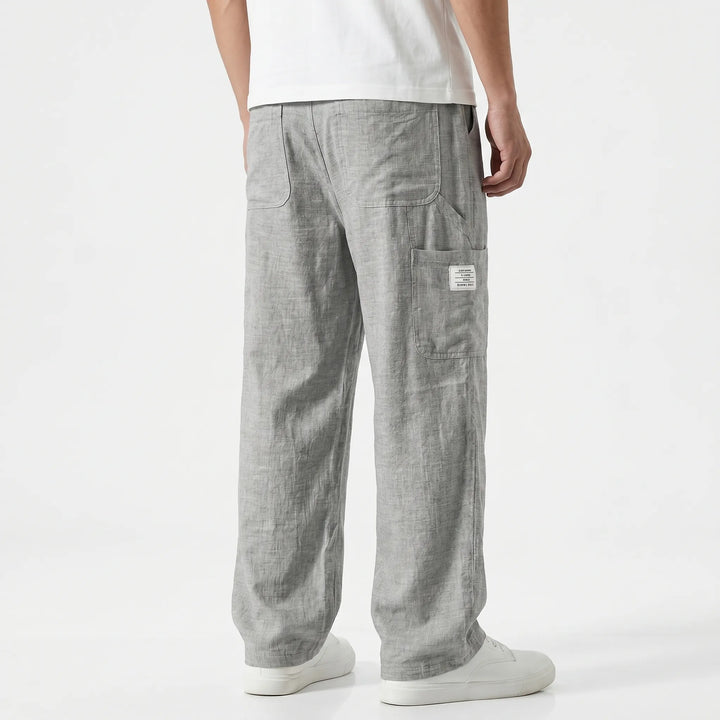 Black men's loose fit straight-leg cargo pants with an adjustable waist for ultimate comfort.