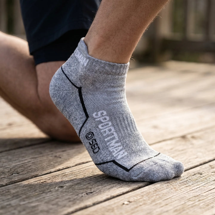 Six pairs of men's low-cut athletic socks, ideal for running, gym, and various sports activities.