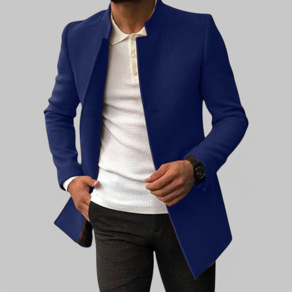 Close-up of the pocket on a men's minimalist winter trench coat. Smart casual, tailored long sleeve outerwear.