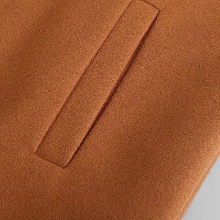 Men's tailored long sleeve winter coat, minimalist style, side view. Smart casual outerwear for business fashion.