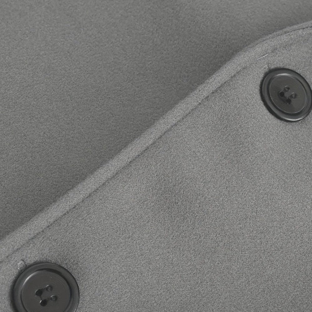 Interior lining detail of a men's minimalist button winter coat. Smart casual, tailored outerwear.