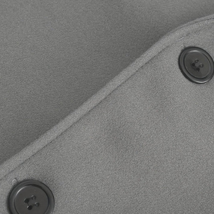 Interior lining detail of a men's minimalist button winter coat. Smart casual, tailored outerwear.